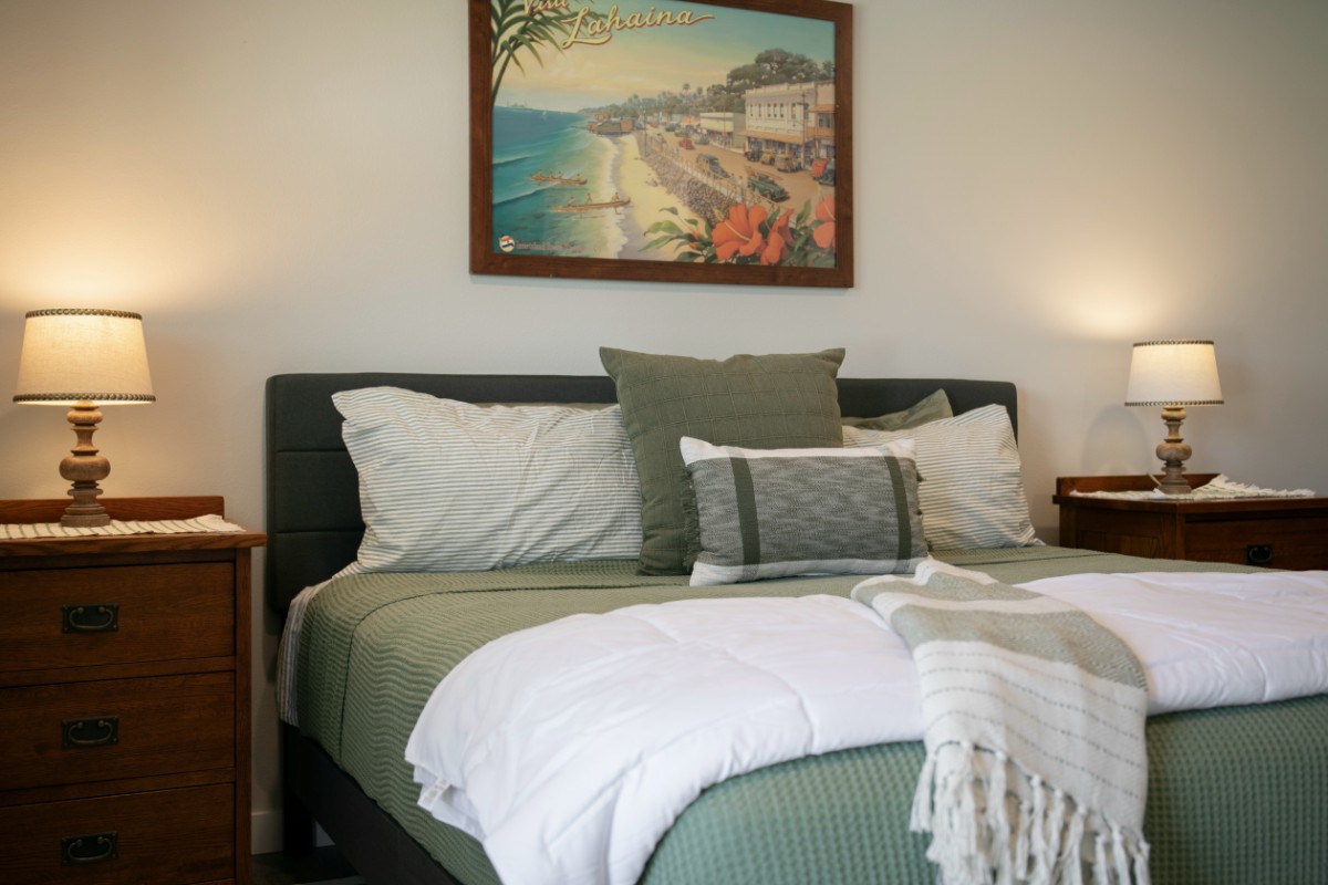 Mini barndominium bedroom — queen bed, matching nightstands and lamps